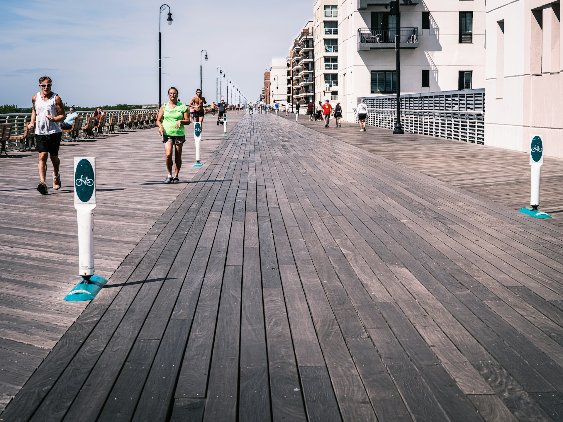 people jogging on the boardwalk